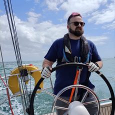 Garry Whatton at the helm of a yacht